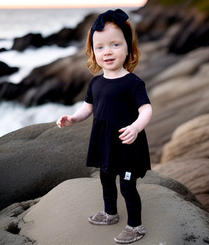Front Opening Twirl Romper in Jet Black-white logo