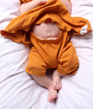 Front Opening Twirl Shortie Romper in Amber | Ribbed Bamboo Viscose