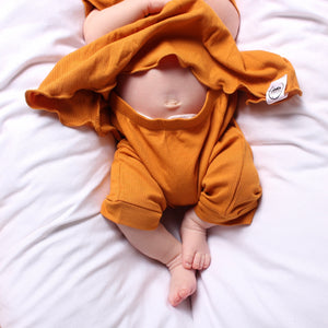 Front Opening Twirl Shortie Romper in Amber | Ribbed Bamboo Viscose